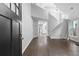 Bright entryway featuring soaring ceilings, hardwood floors, and a staircase to the upper level at 969 Oak Sw St, Atlanta, GA 30310
