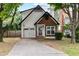 Attractive home featuring a single-car garage, landscaped yard, and inviting front entrance at 969 Oak Sw St, Atlanta, GA 30310