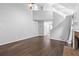 Spacious living room with hardwood floors, vaulted ceiling and access to other areas of the house at 969 Oak Sw St, Atlanta, GA 30310
