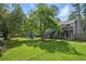 Large grassy backyard featuring a fire pit and chairs, ideal for outdoor gatherings and relaxation at 1501 Jamerson Landing, Marietta, GA 30066
