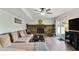 Cozy basement with stone fireplace, ceiling fan, and access to outdoor patio at 1501 Jamerson Landing, Marietta, GA 30066