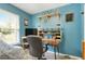 Blue bedroom with a cozy desk, a sturdy computer chair, and a large window at 1501 Jamerson Landing, Marietta, GA 30066