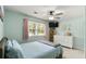Bedroom with a ceiling fan, dresser, natural lighting, and comfortable decor at 1501 Jamerson Landing, Marietta, GA 30066