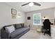 Comfortable bedroom featuring a couch, desk, a ceiling fan, and a large window at 1501 Jamerson Landing, Marietta, GA 30066