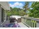 Outdoor deck with comfortable seating and a table, perfect for relaxation and outdoor entertainment at 1501 Jamerson Landing, Marietta, GA 30066
