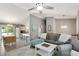 Spacious living room with a high ceiling, hardwood floors, an adjacent kitchen, and sliding glass doors at 1501 Jamerson Landing, Marietta, GA 30066