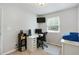 A well-lit home office with an L-shaped desk, rolling chair, and modern computer setup at 1501 Jamerson Landing, Marietta, GA 30066