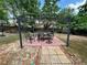 Backyard featuring a gazebo with dining set on a patio; ideal for enjoying al fresco meals and outdoor entertaining at 1782 Telfair Chase Way, Lawrenceville, GA 30043
