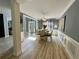 Open concept dining room with light wood flooring and modern lighting at 1782 Telfair Chase Way, Lawrenceville, GA 30043