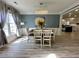 Inviting dining room with modern chandelier and views from the large window at 1782 Telfair Chase Way, Lawrenceville, GA 30043