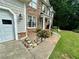Charming two-story home featuring stone and shingle siding with a well-manicured lawn at 1782 Telfair Chase Way, Lawrenceville, GA 30043
