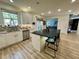 Bright kitchen features a large island with seating, stainless steel appliances, and white cabinets at 1782 Telfair Chase Way, Lawrenceville, GA 30043