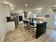 Bright kitchen features a large island with seating, stainless steel appliances, and white cabinets at 1782 Telfair Chase Way, Lawrenceville, GA 30043