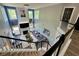 Aerial view from staircase overlooking living room with fireplace, large windows, and chandelier at 1782 Telfair Chase Way, Lawrenceville, GA 30043