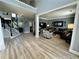 Spacious living room featuring hardwood floors, ample natural light, and a cozy seating area with a comfortable sofa at 1782 Telfair Chase Way, Lawrenceville, GA 30043