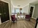 Upstairs loft featuring a chandelier, sitting area, and dark paneled doors at 1782 Telfair Chase Way, Lawrenceville, GA 30043