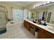 Main bathroom featuring shower, soaking tub, vanity area, and bright natural light at 1782 Telfair Chase Way, Lawrenceville, GA 30043