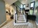 Beautiful staircase leading to the second floor, with views of the living room at 1782 Telfair Chase Way, Lawrenceville, GA 30043
