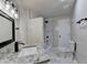 Bathroom boasts marble floors and shower, granite vanity, and modern fixtures at 2211 Rocky Mill Dr, Lawrenceville, GA 30044