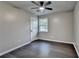 Bedroom with hard wood floors, ceiling fan and natural light at 2211 Rocky Mill Dr, Lawrenceville, GA 30044