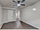 Bedroom featuring gray walls, dark wood-look floors, and white doors at 2211 Rocky Mill Dr, Lawrenceville, GA 30044