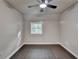 Bedroom featuring gray walls, dark wood-look floors, and a window at 2211 Rocky Mill Dr, Lawrenceville, GA 30044