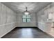 Formal dining room featuring hardwood floors, chair railing, and an elegant chandelier at 2211 Rocky Mill Dr, Lawrenceville, GA 30044