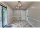 Eat-in dining area featuring sliding door access to the outdoor deck and stylish lighting at 2211 Rocky Mill Dr, Lawrenceville, GA 30044