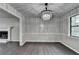 Spacious dining room with hardwood floors, chair railing, and a glimpse of the cozy fireplace at 2211 Rocky Mill Dr, Lawrenceville, GA 30044