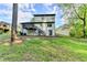 Rear exterior featuring a deck, stairs, and access to the basement level at 2211 Rocky Mill Dr, Lawrenceville, GA 30044