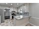 Renovated kitchen featuring granite countertops, stainless steel appliances, and a breakfast bar at 2211 Rocky Mill Dr, Lawrenceville, GA 30044