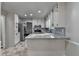 Bright kitchen with white cabinets, stainless steel appliances, and attractive granite countertops at 2211 Rocky Mill Dr, Lawrenceville, GA 30044