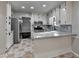 Bright kitchen with white cabinets, stainless steel appliances, and attractive granite countertops at 2211 Rocky Mill Dr, Lawrenceville, GA 30044