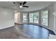 Spacious living room with a bay window, ceiling fan, and hardwood flooring at 2211 Rocky Mill Dr, Lawrenceville, GA 30044