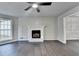 Bright living room with hardwood floors, fireplace, and natural light at 2211 Rocky Mill Dr, Lawrenceville, GA 30044
