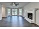 Bright living room featuring a fireplace, hardwood floors, and natural light at 2211 Rocky Mill Dr, Lawrenceville, GA 30044