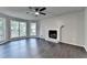 Bright living room with hardwood floors, fireplace, and bay window at 2211 Rocky Mill Dr, Lawrenceville, GA 30044