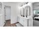 Bright bathroom featuring a double vanity with two large mirrors and modern fixtures at 30 Dewey Se Ln, Marietta, GA 30060