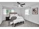 Sun-filled bedroom featuring neutral decor, a ceiling fan, and plush carpet at 30 Dewey Se Ln, Marietta, GA 30060