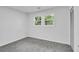 Clean and modern bedroom with plush carpet and ample natural light at 30 Dewey Se Ln, Marietta, GA 30060