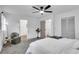 Well-lit bedroom with neutral decor and bright natural light from the two large windows at 30 Dewey Se Ln, Marietta, GA 30060