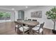 Bright dining room boasts hardwood floors, neutral decor and an elegant oval table at 30 Dewey Se Ln, Marietta, GA 30060
