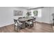 Bright dining room with an oval table, seating for six, and hardwood floors at 30 Dewey Se Ln, Marietta, GA 30060