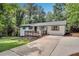 Charming single-story home with white siding, a welcoming front porch, and a well-maintained front yard at 30 Dewey Se Ln, Marietta, GA 30060