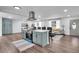 Open floor plan with kitchen island featuring cooktop, seating, and easy access to the living area at 30 Dewey Se Ln, Marietta, GA 30060