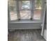Bright bathroom featuring a window seat, modern shower and stylish tile work at 735 Brookwood Dr, Forest Park, GA 30297