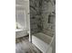 Bathroom with modern shower and stylish tile work at 735 Brookwood Dr, Forest Park, GA 30297