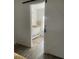 Modern bathroom featuring elegant vanity and fixtures viewed through sliding barn door at 735 Brookwood Dr, Forest Park, GA 30297