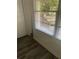 Comfortable bedroom corner featuring natural light through window and ample storage at 735 Brookwood Dr, Forest Park, GA 30297