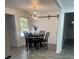 Bright dining room with a stylish chandelier and sliding barn door at 735 Brookwood Dr, Forest Park, GA 30297